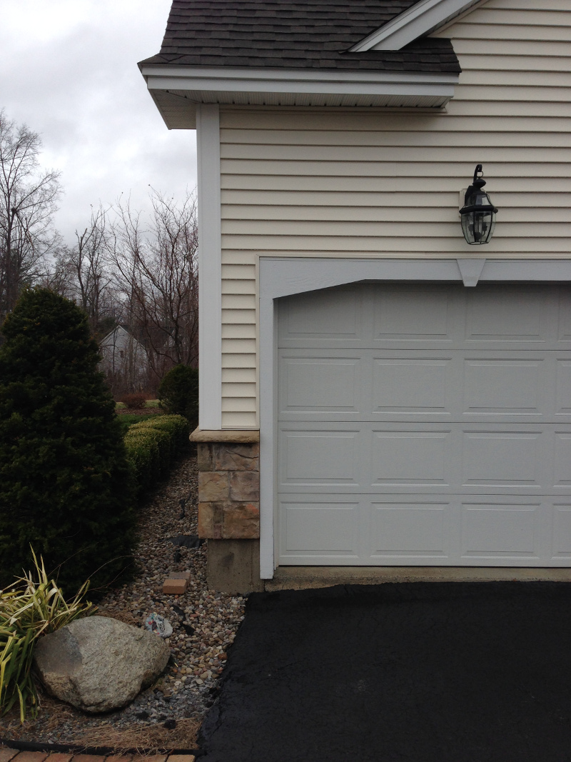 Rain Water Damaged Driveway Showing Garage, Driveway Erosion