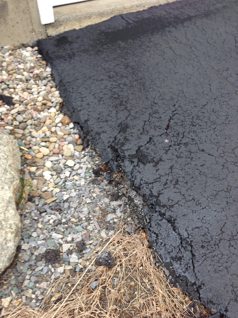 Rain Water Damaged Driveway Showing Garage, Driveway Erosion