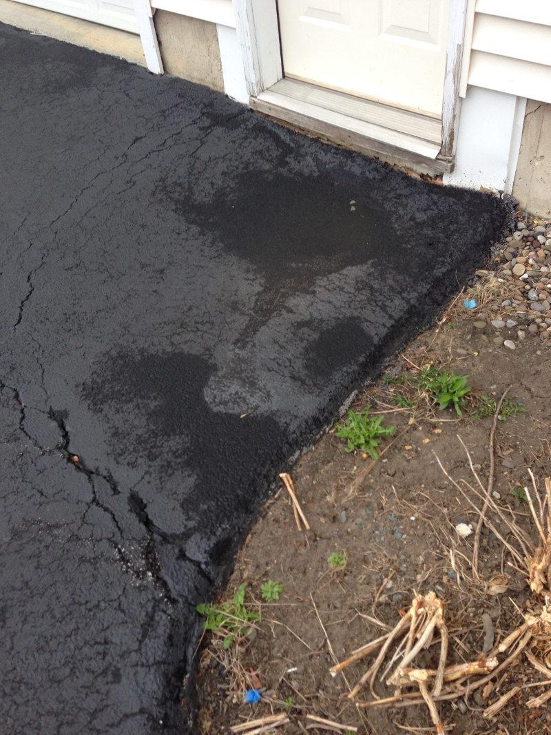 Rain Water Damaged Driveway Showing Garage, Driveway Erosion